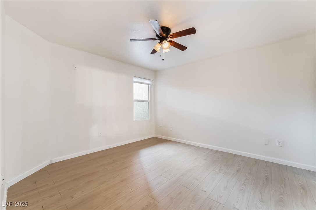 8101 West Flamingo Road, Unit 1090 Las Vegas, NV 89147 - Photo 20 of 30 Unfurnished room featuring light wood-style flooring and ceiling fan