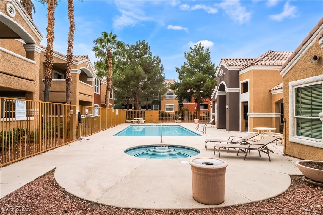 8101 West Flamingo Road, Unit 1090 Las Vegas, NV 89147 - Photo 30 of 30 Community pool with a patio area and a community hot tub