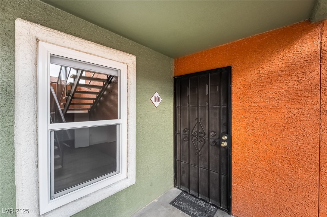 8101 West Flamingo Road, Unit 1090 Las Vegas, NV 89147 - Photo 5 of 30 Property entrance with stucco siding
