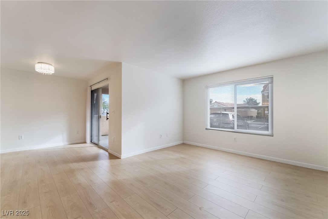 8101 West Flamingo Road, Unit 1090 Las Vegas, NV 89147 - Photo 6 of 30 Empty room with light wood-type flooring and baseboards