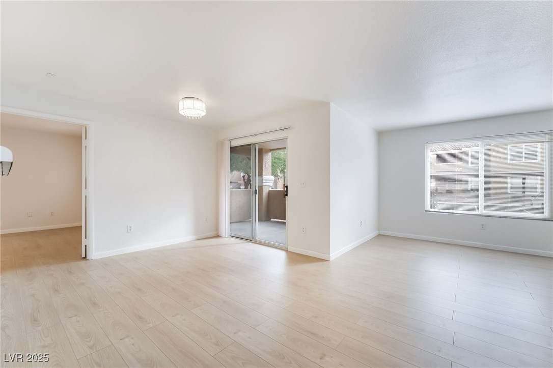 8101 West Flamingo Road, Unit 1090 Las Vegas, NV 89147 - Photo 9 of 30 Unfurnished room featuring light wood finished floors and baseboards
