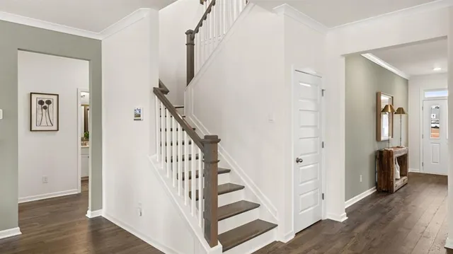 a bedroom with a large bed and a chandelier fan