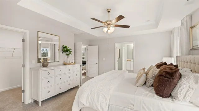 a en suite bathroom with double sink a toilet a mirror and shower