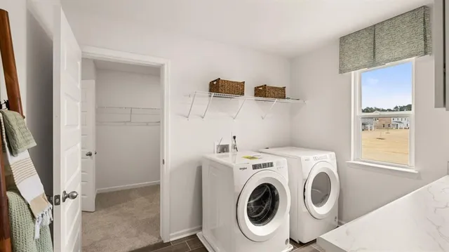 a kitchen with cabinets appliances a sink and a window