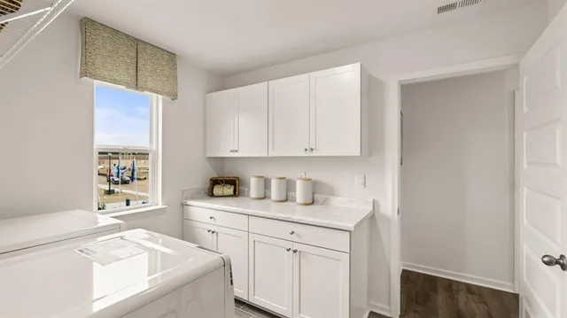 a front view of a house with a yard table and chairs