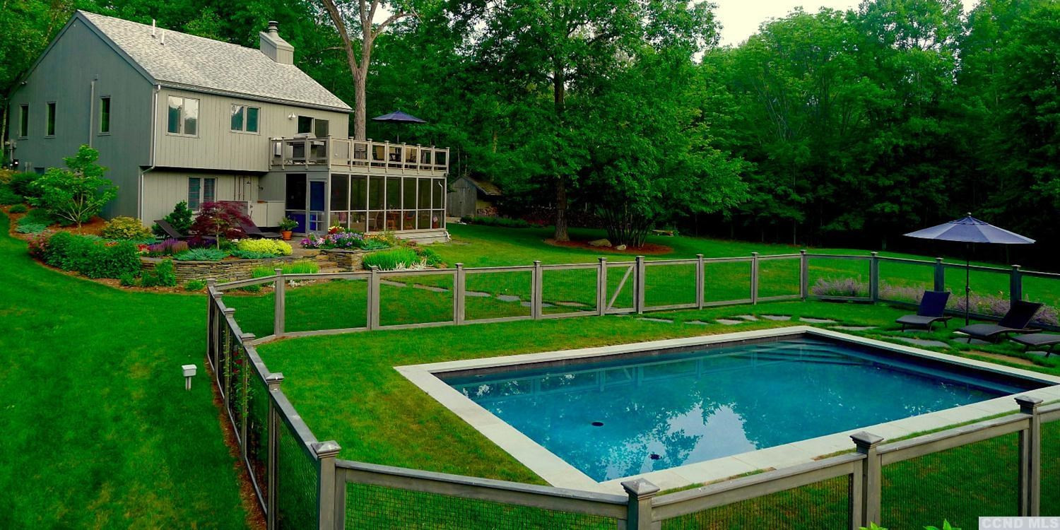 86 Pond Hill Road Copake, NY 12521 - Photo 1 of 10 a view of a house with a backyard