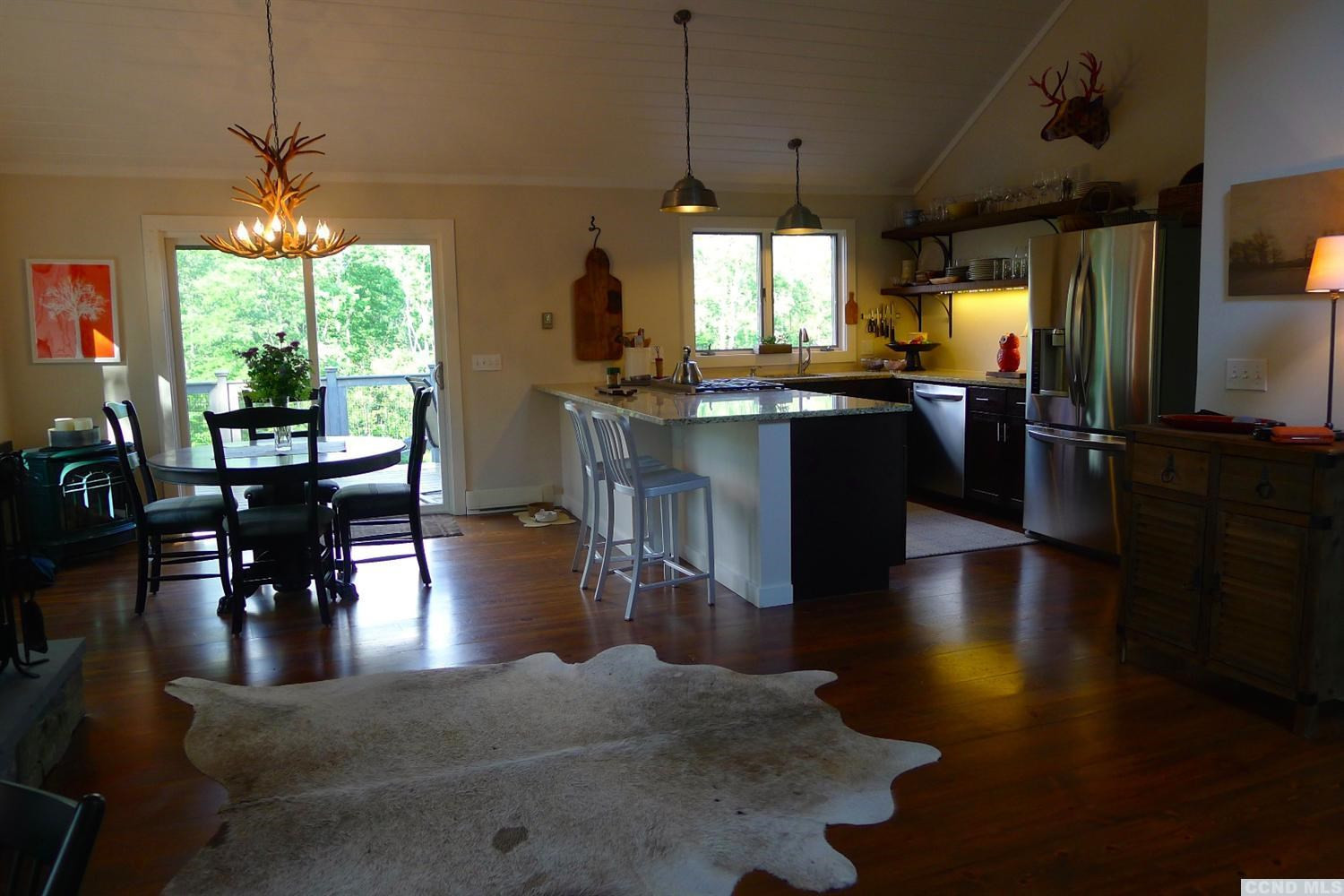 86 Pond Hill Road Copake, NY 12521 - Photo 3 of 10 a open kitchen with stainless steel appliances granite countertop a stove and refrigerator