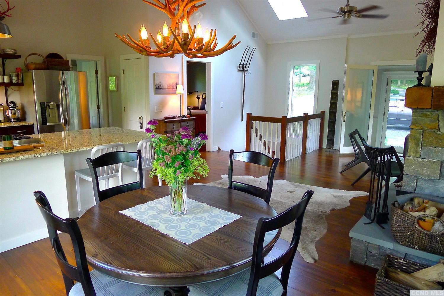 86 Pond Hill Road Copake, NY 12521 - Photo 4 of 10 a view of a dining room with furniture and wooden floor