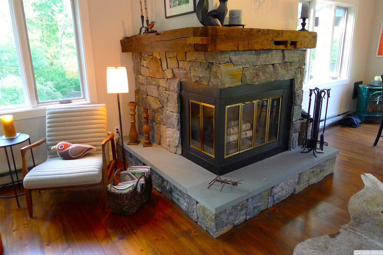 86 Pond Hill Road Copake, NY 12521 - Photo 5 of 10 a living room with furniture and a fireplace
