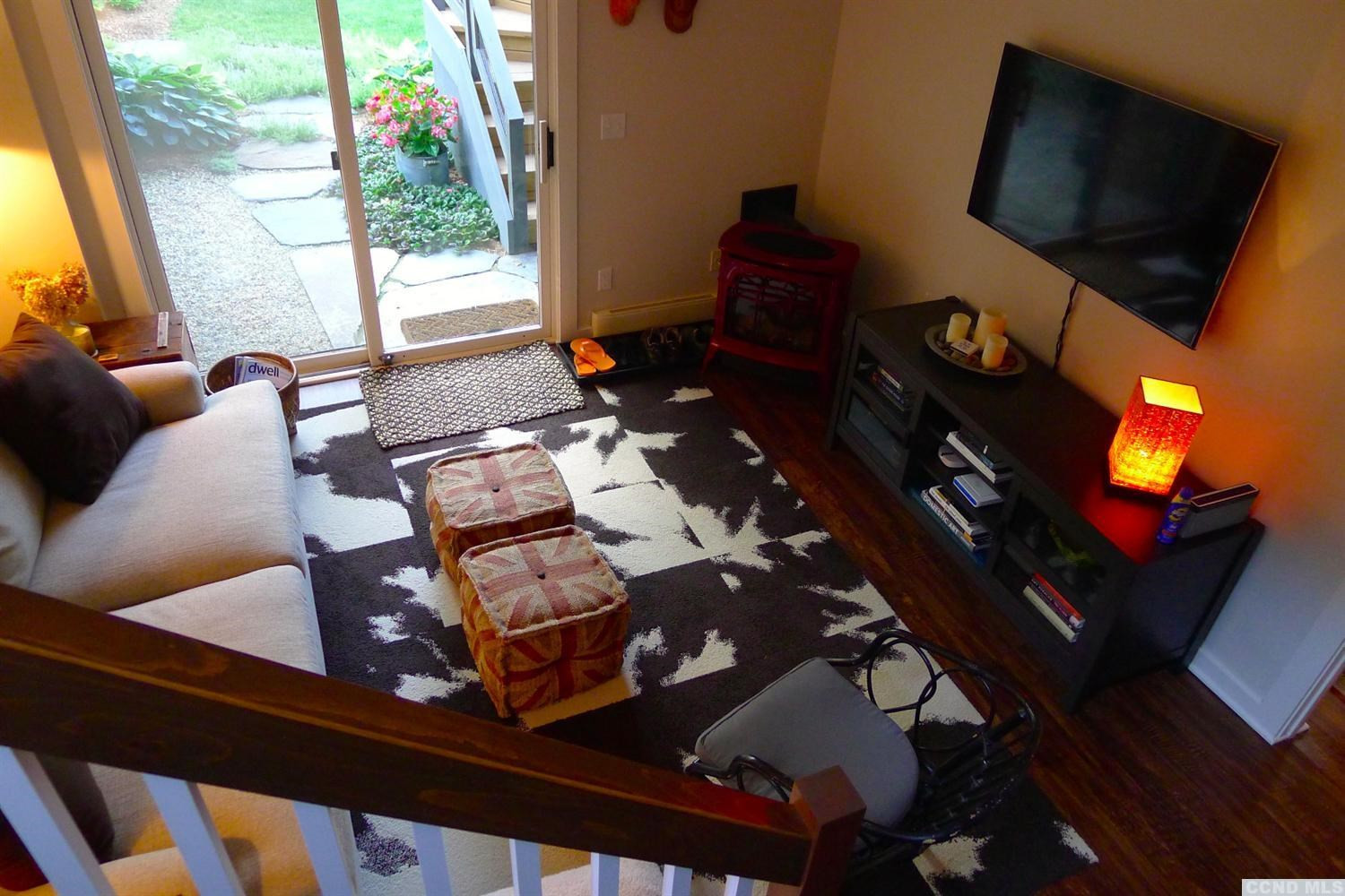 86 Pond Hill Road Copake, NY 12521 - Photo 6 of 10 a living room with furniture and a flat screen tv