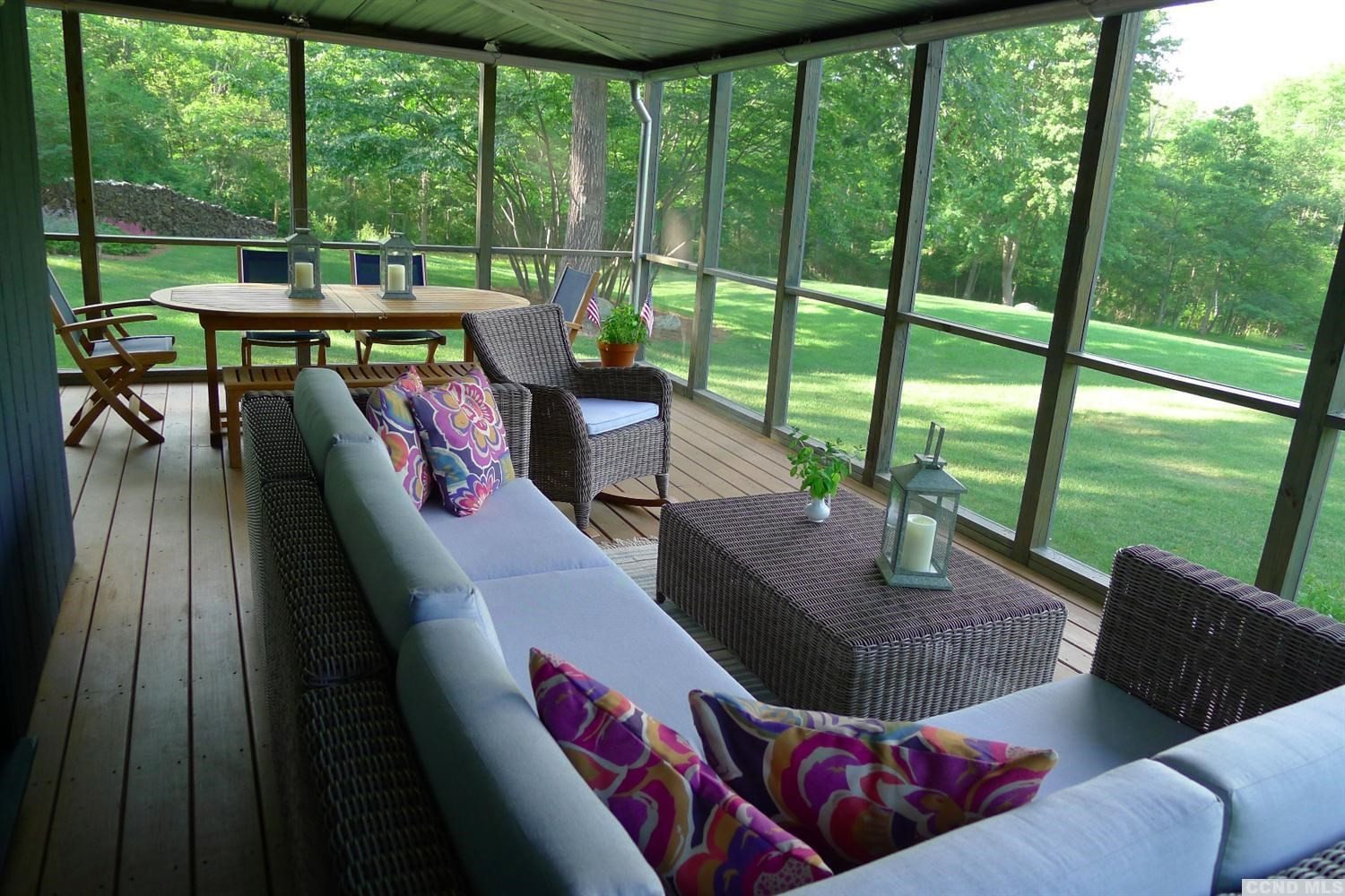 86 Pond Hill Road Copake, NY 12521 - Photo 7 of 10 a living room with furniture and a floor to ceiling window