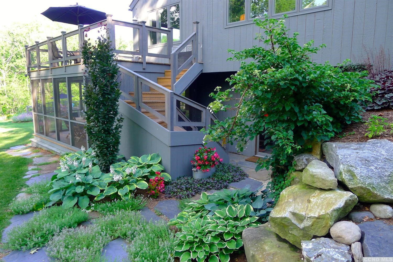 86 Pond Hill Road Copake, NY 12521 - Photo 8 of 10 a flower garden with lots of potted plants