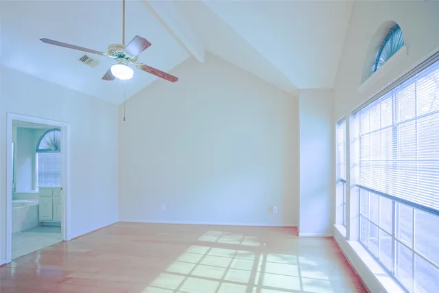 a view of an empty room with windows