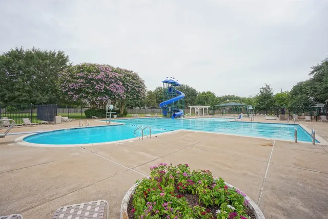 a view of a swimming pool with seating