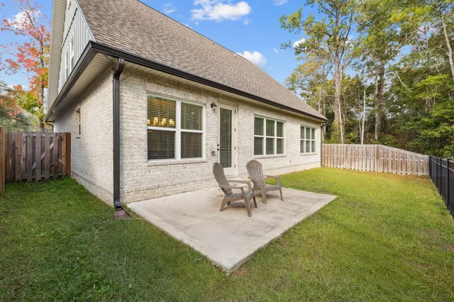 a house view with a seating space and garden