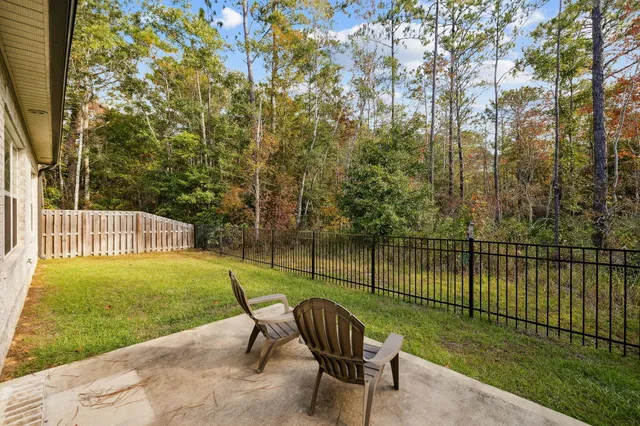 a view of a chair and table on the river