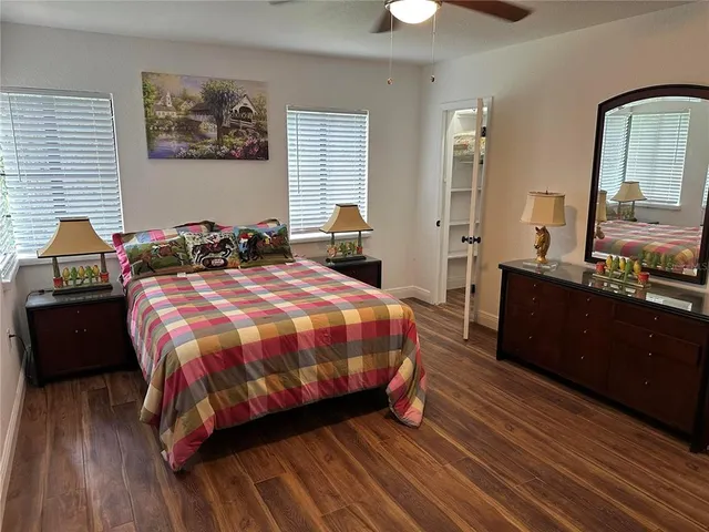 a bed sitting in a bedroom next to a window