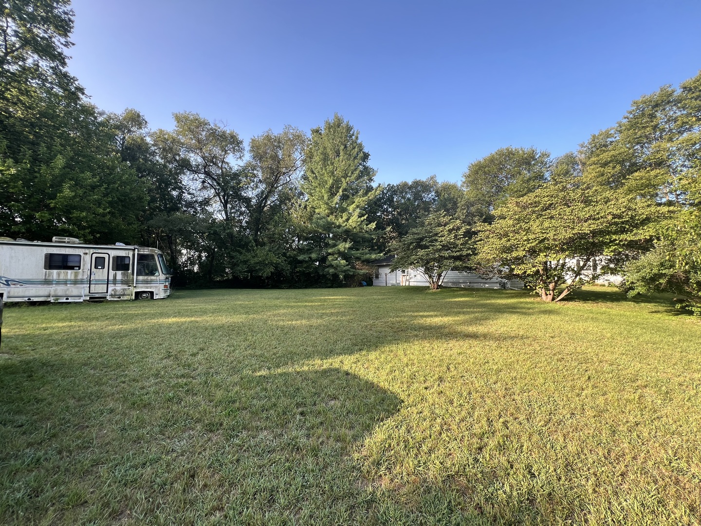 0 Hill Road Morris, IL 60450 - Photo 2 of 4 a view of a swimming pool with lawn chairs and plants