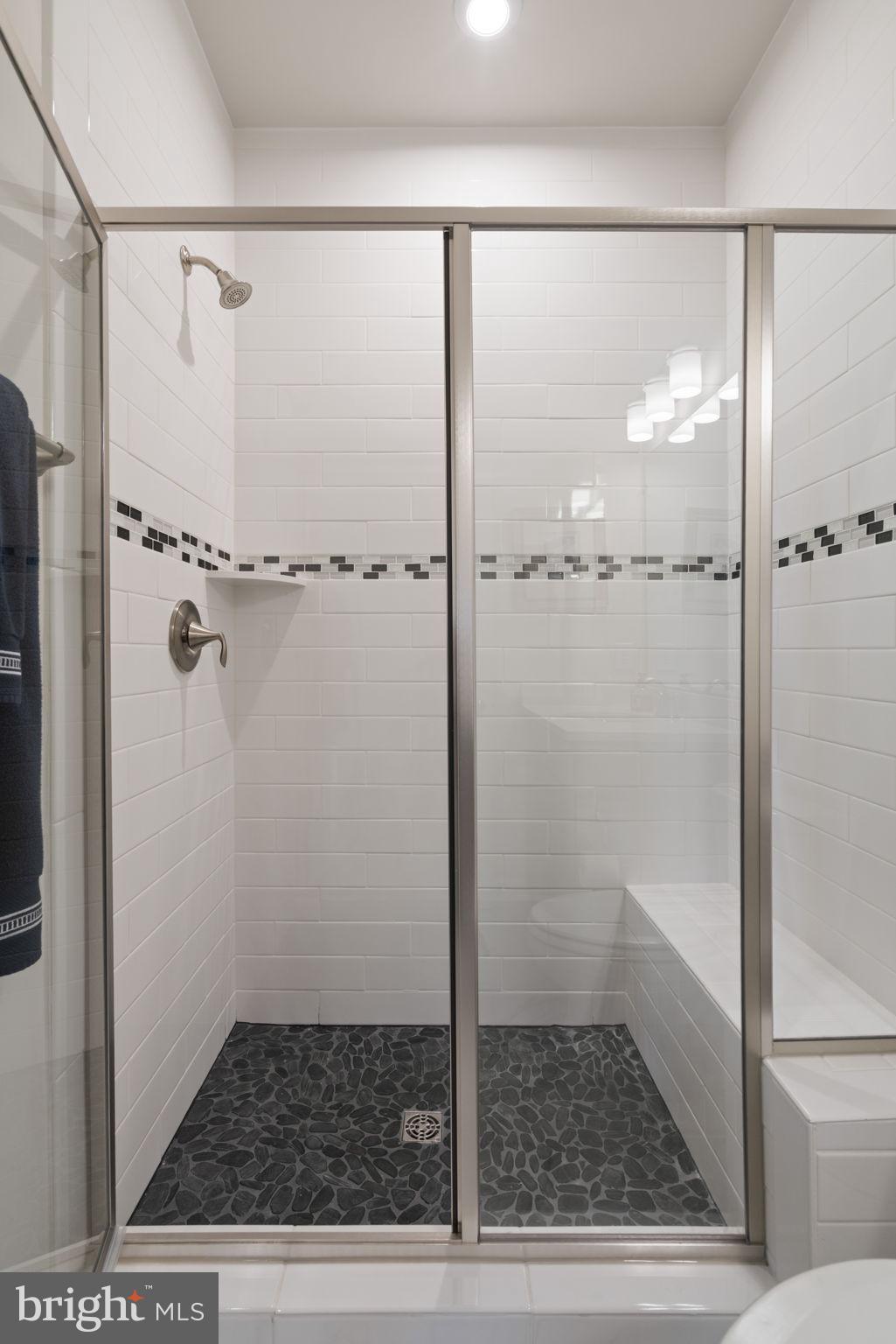 15795 Gardenia Rdg Way Haymarket, VA 20169 - Photo 23 of 63 a bathroom with a glass shower door