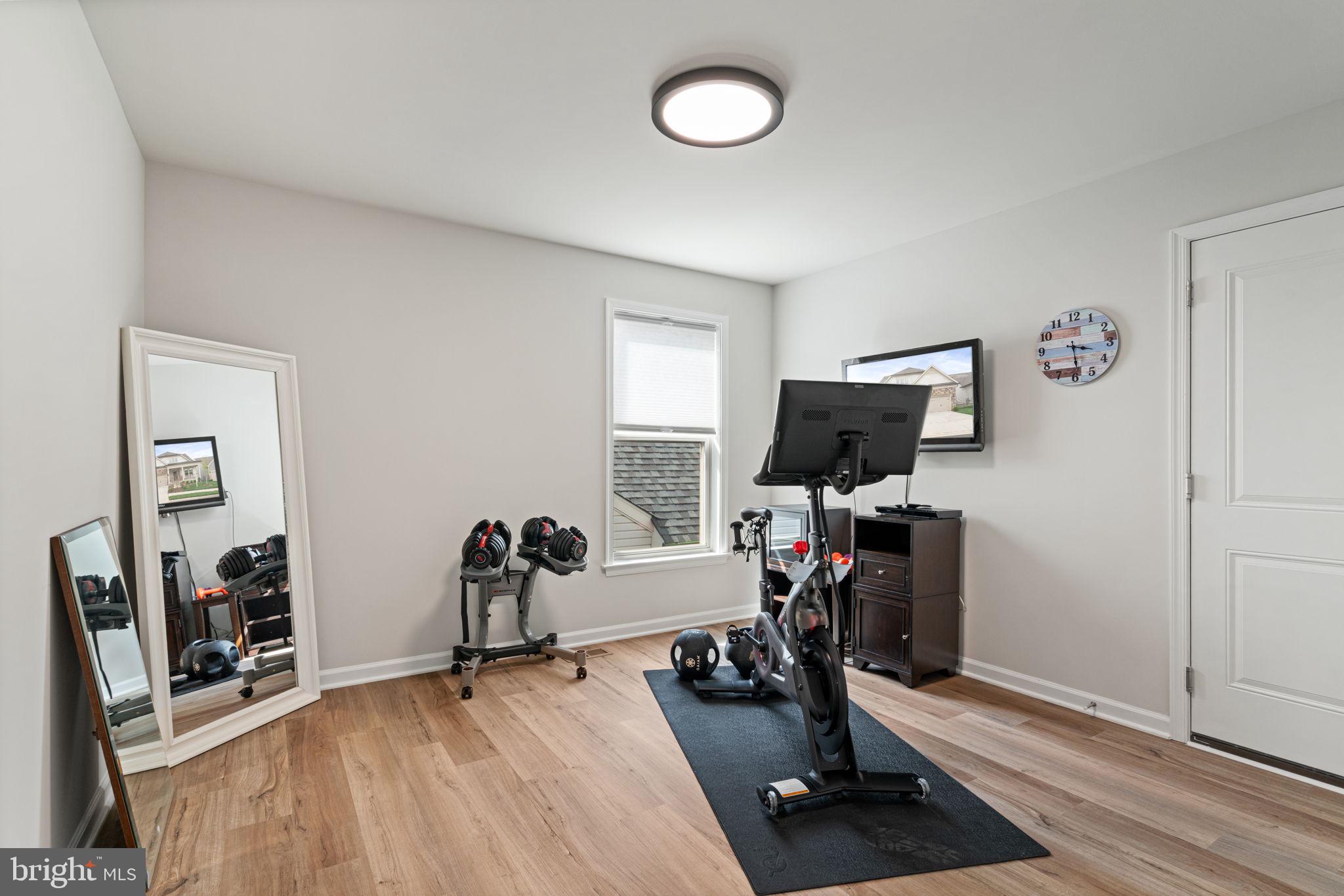 15795 Gardenia Rdg Way Haymarket, VA 20169 - Photo 27 of 63 a view of a livingroom with furniture and a flat screen tv