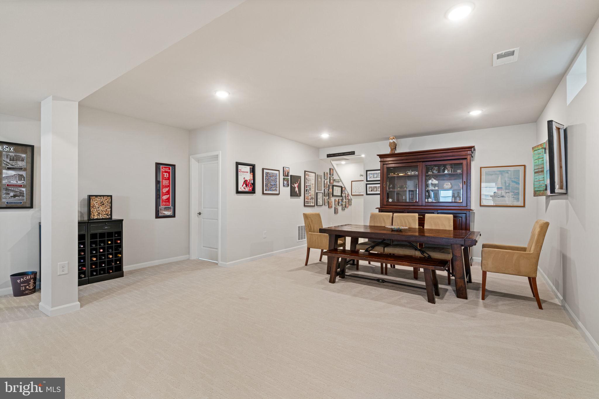 15795 Gardenia Rdg Way Haymarket, VA 20169 - Photo 33 of 63 a living room with furniture and a flat screen tv