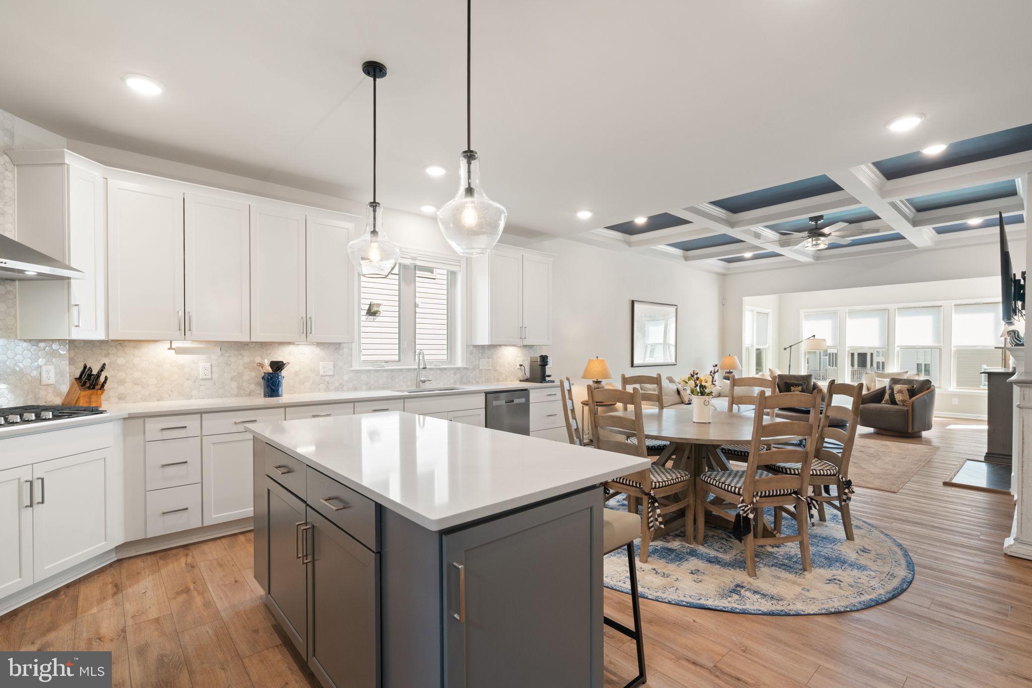 15795 Gardenia Rdg Way Haymarket, VA 20169 - Photo 5 of 63 a large kitchen with lots of counter space a sink dining table and chairs