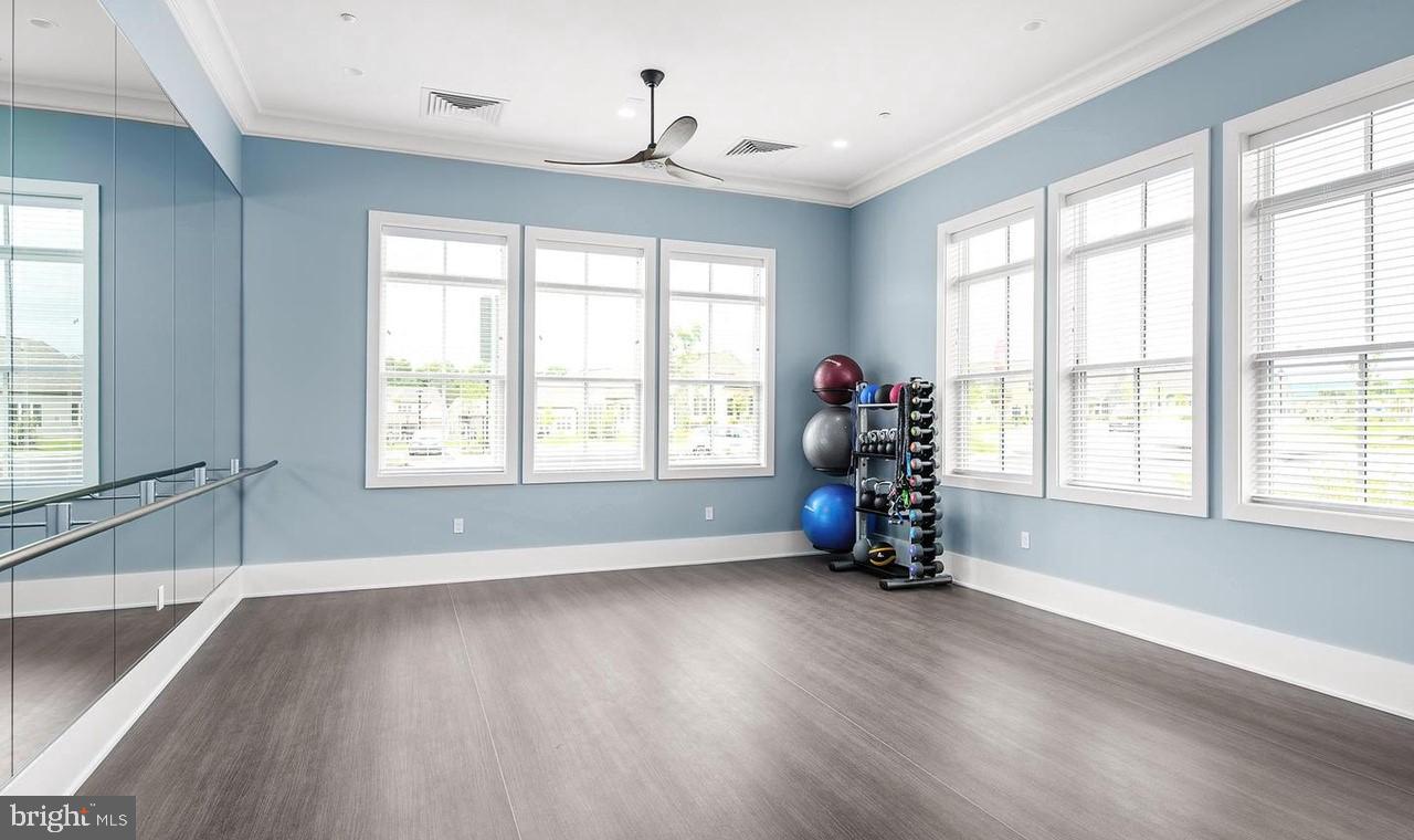15795 Gardenia Rdg Way Haymarket, VA 20169 - Photo 49 of 63 a view of an empty room with wooden floor and a window