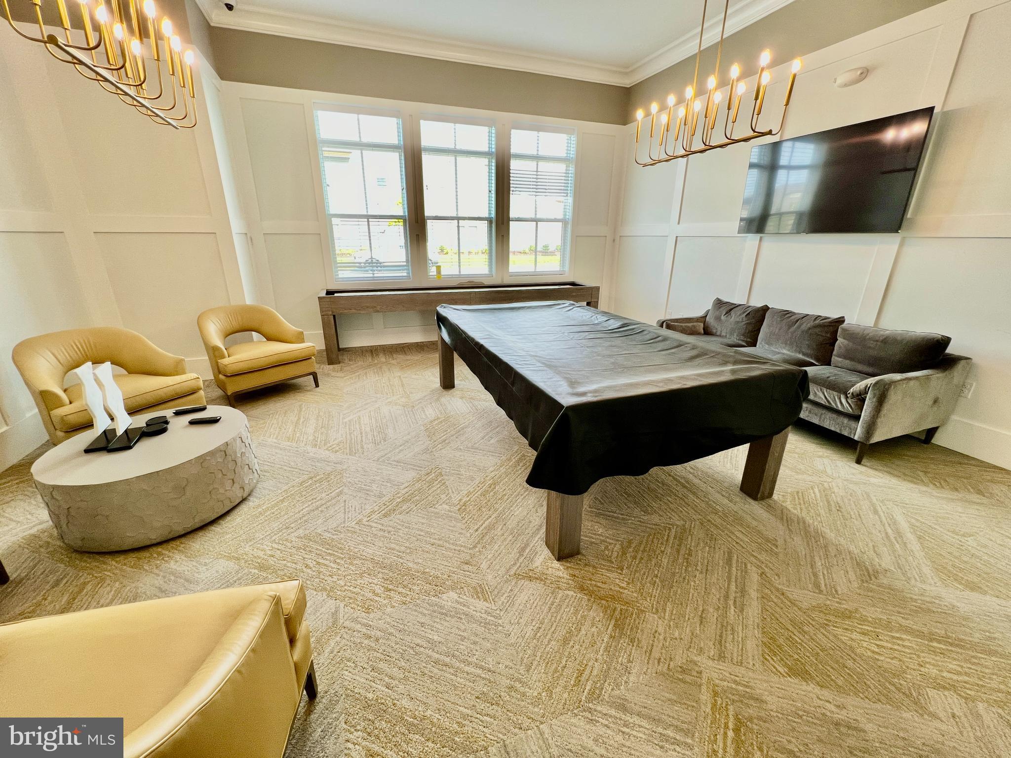 15795 Gardenia Rdg Way Haymarket, VA 20169 - Photo 50 of 63 a living room with furniture and a flat screen tv
