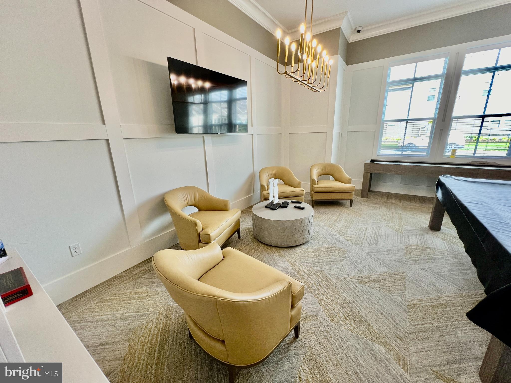 15795 Gardenia Rdg Way Haymarket, VA 20169 - Photo 51 of 63 a living room with furniture and a flat screen tv