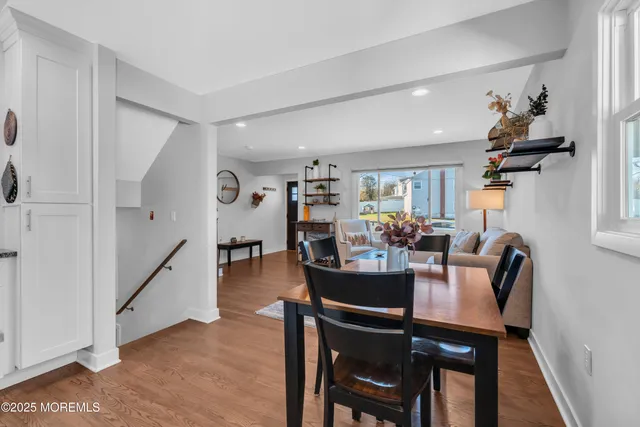a view of a dining room with furniture and a livingroom