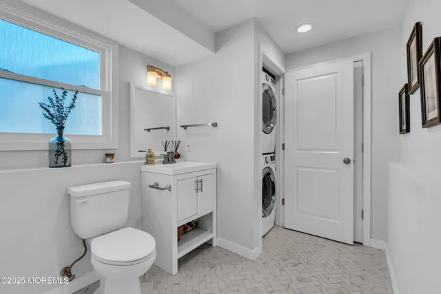 a bathroom with a toilet sink and shower
