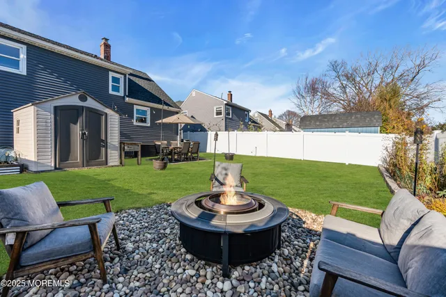 a house view with a garden space and outdoor seating