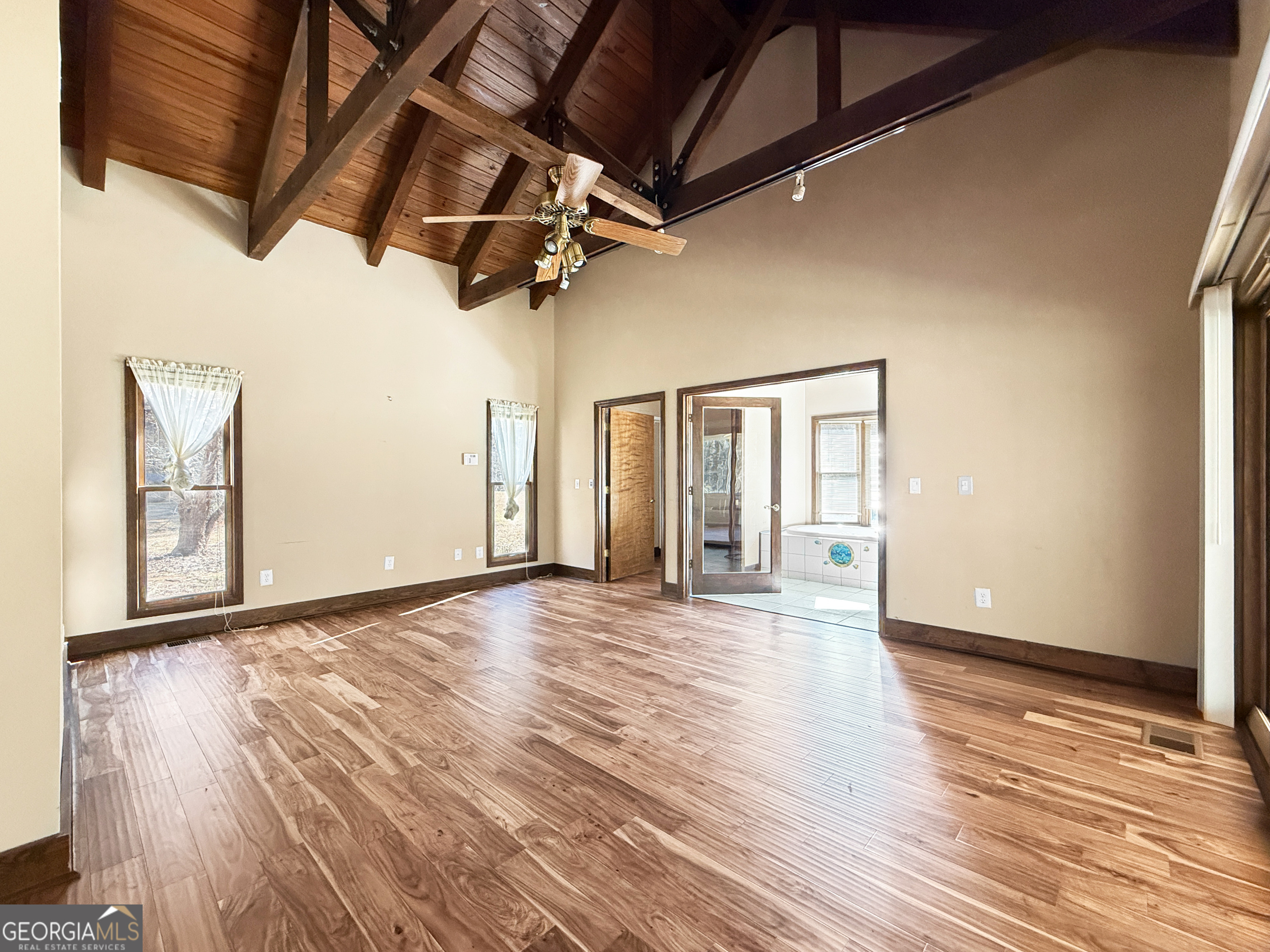 1140 Highway 54 Moreland, GA 30259 - Photo 16 of 39 a view of an empty room with wooden floor and windows