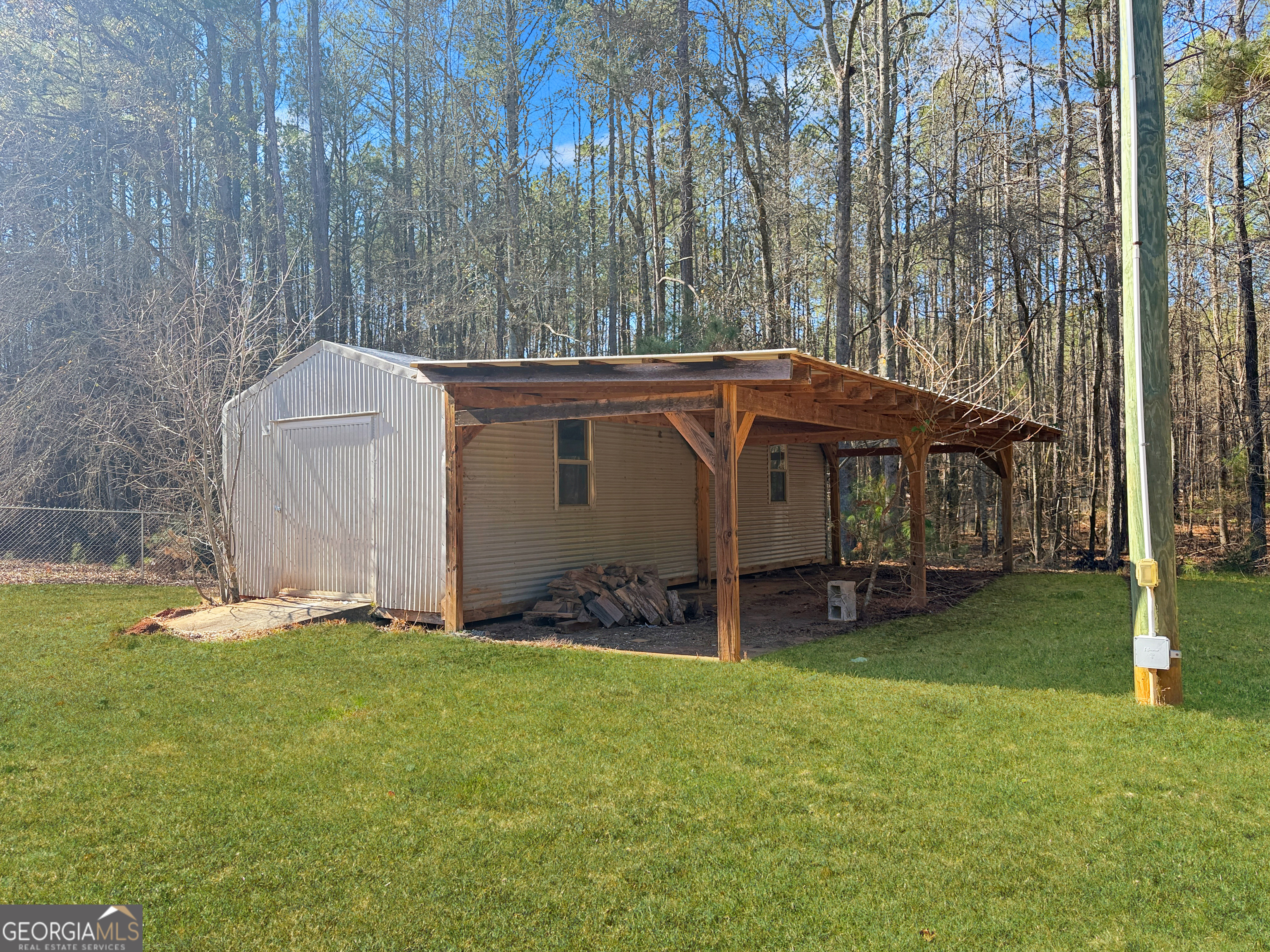 1140 Highway 54 Moreland, GA 30259 - Photo 33 of 39 a view of a house with backyard and a tree
