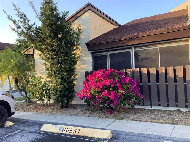 a kitchen with a stove a refrigerator and a window