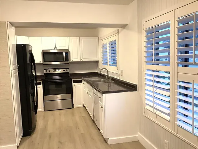 a kitchen with a stove and a microwave