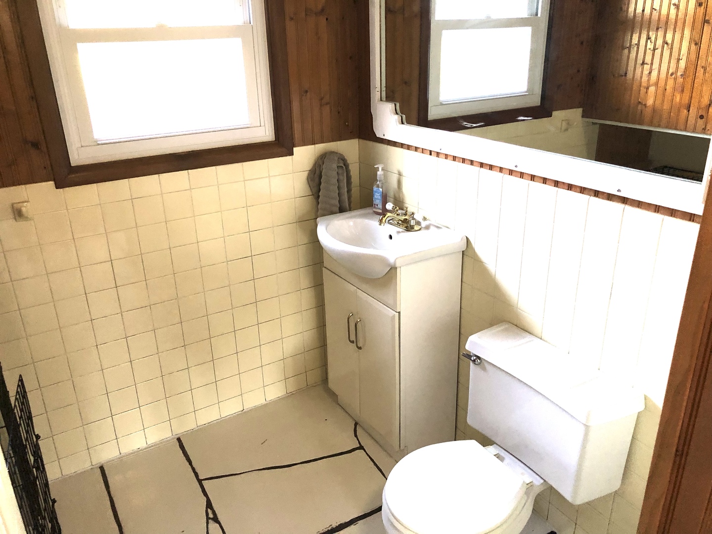 348 Swanson Road Sycamore, IL 60178 - Photo 14 of 20 a bathroom with a sink a toilet and window