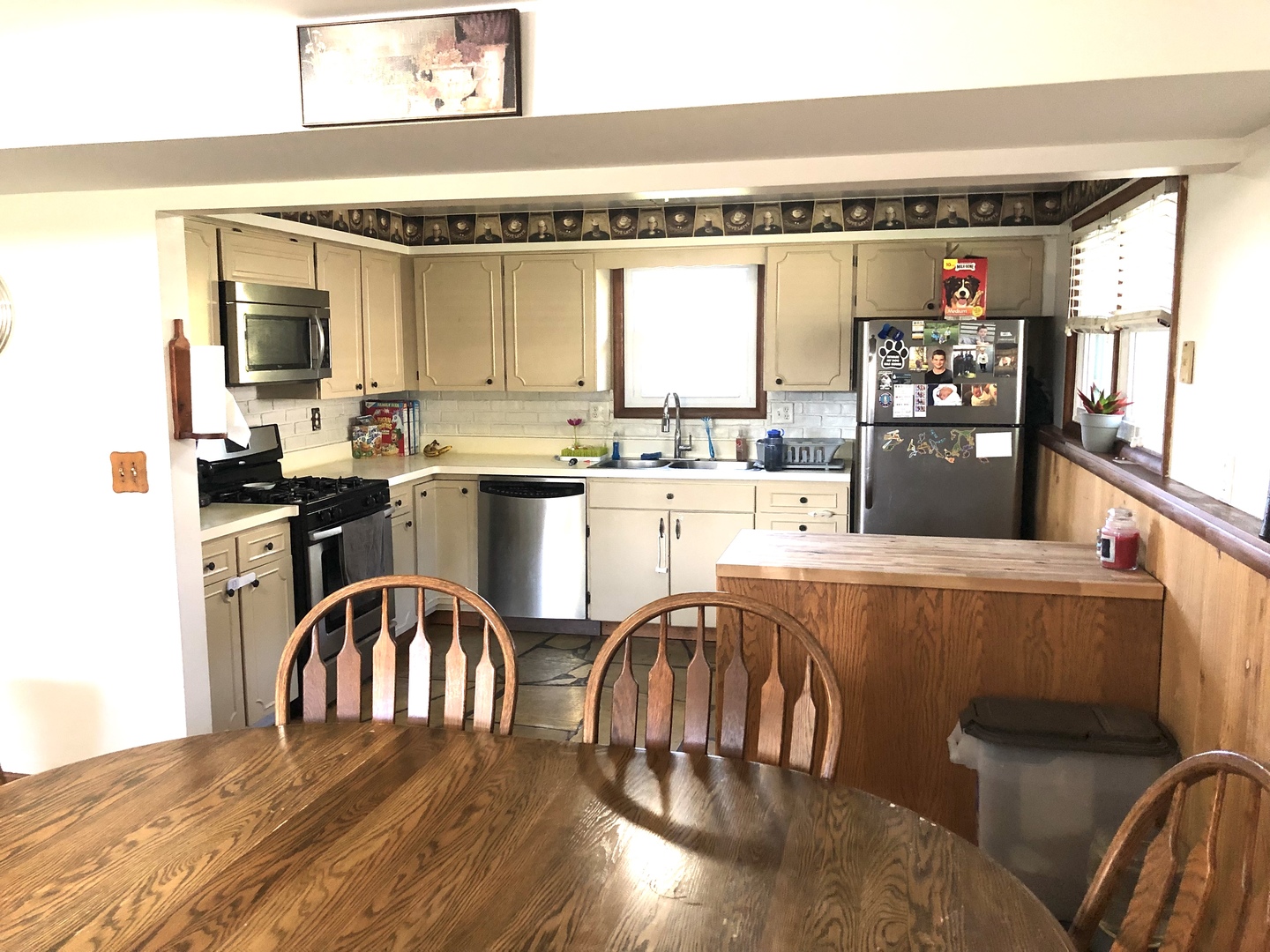 348 Swanson Road Sycamore, IL 60178 - Photo 6 of 20 a kitchen with a table chairs stove and cabinets