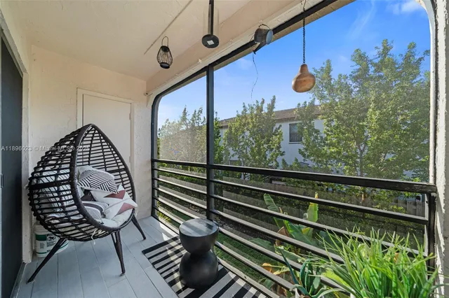 a view of a balcony with chairs