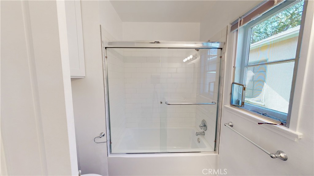526 North Madison Avenue Pasadena, CA 91101 - Photo 12 of 21 a bathroom with a glass shower door