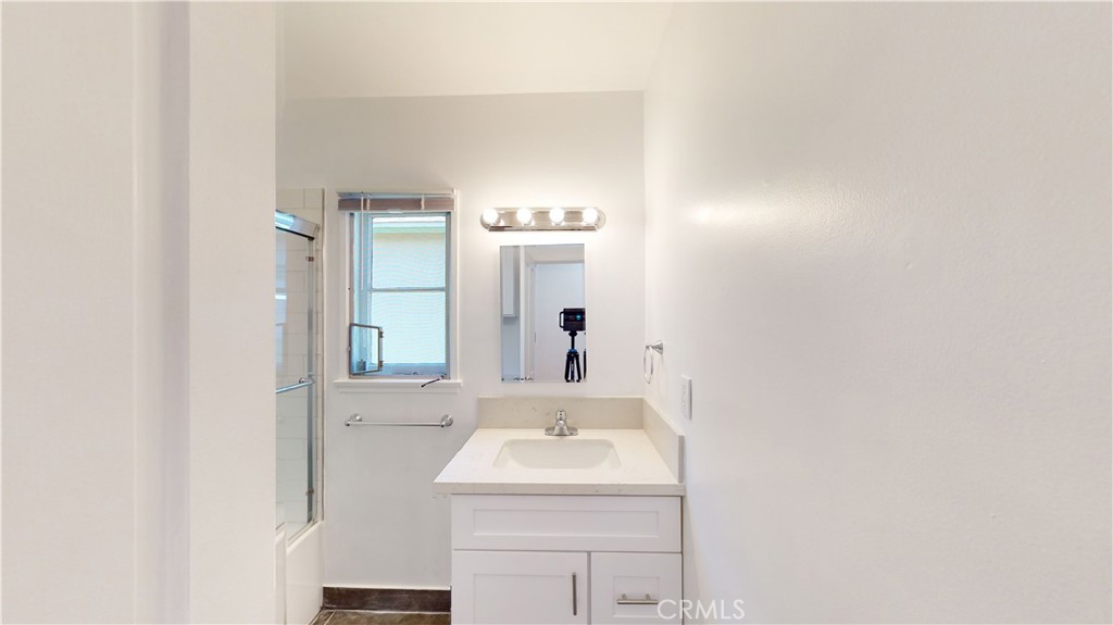 526 North Madison Avenue Pasadena, CA 91101 - Photo 15 of 21 a bathroom with a sink and a mirror