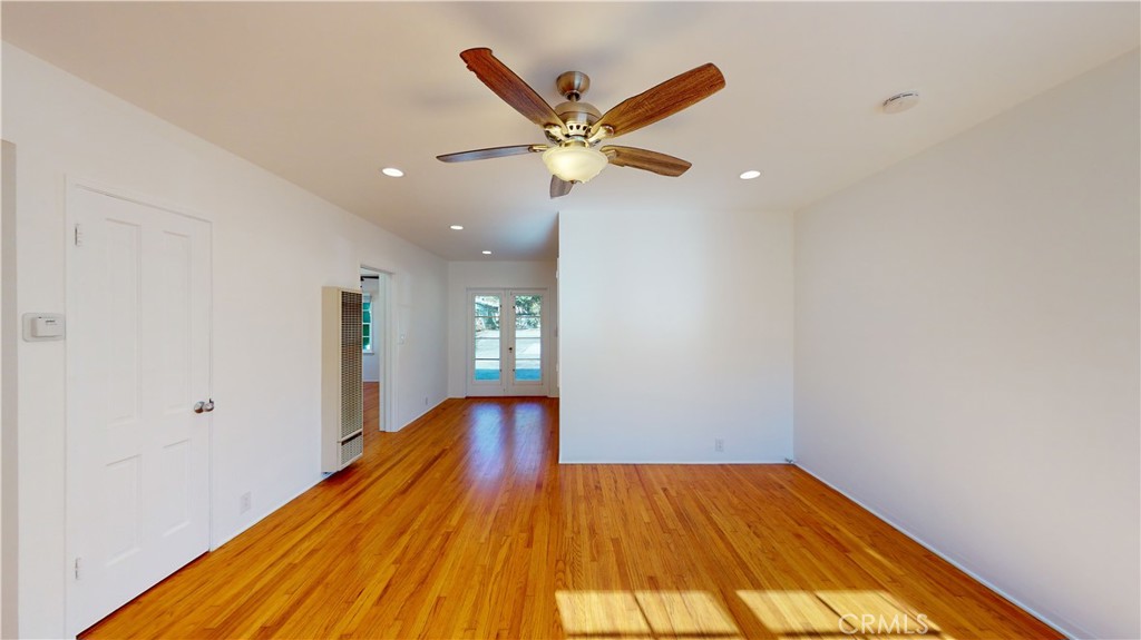 526 North Madison Avenue Pasadena, CA 91101 - Photo 9 of 21 a view of a room with wooden floor and a ceiling fan