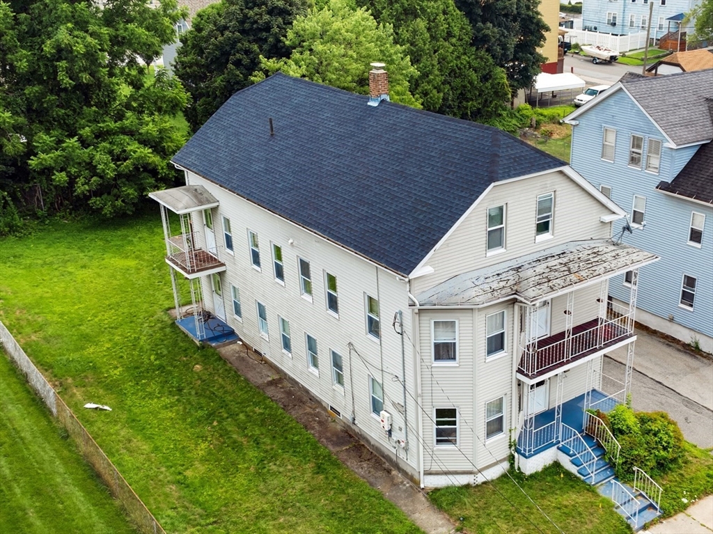 29 Whitcomb Street Webster, MA 01570 - Photo 2 of 17 a aerial view of house with yard in front of it