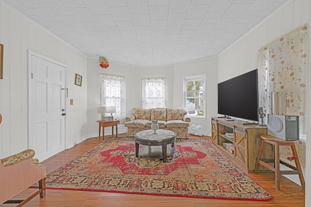29 Whitcomb Street Webster, MA 01570 - Photo 5 of 17 a living room with furniture and a flat screen tv