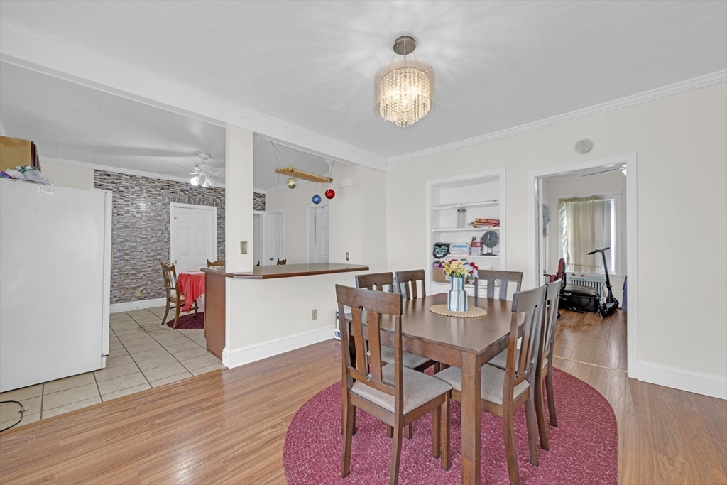 29 Whitcomb Street Webster, MA 01570 - Photo 8 of 17 a view of a dining room with furniture and wooden floor