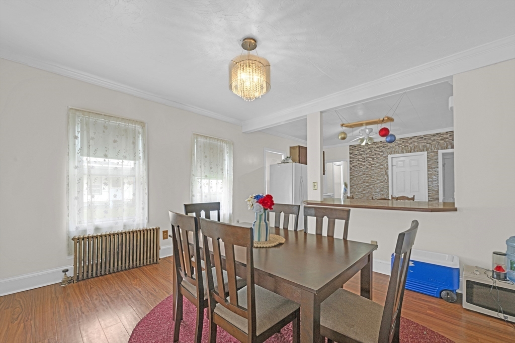 29 Whitcomb Street Webster, MA 01570 - Photo 9 of 17 a view of a dining room with furniture and wooden floor