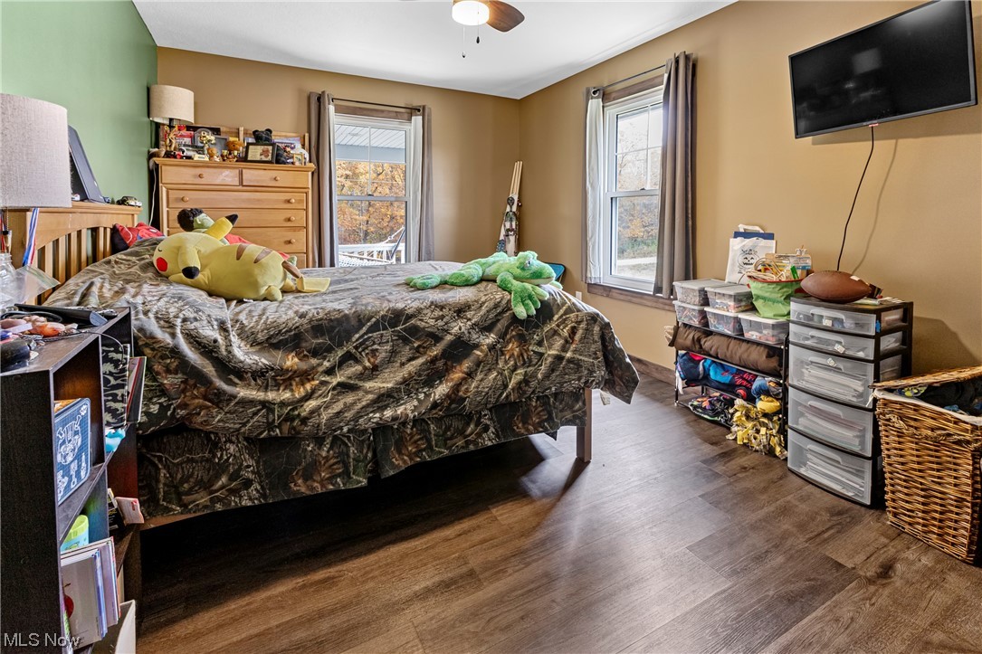 45588 County Road Cadiz, OH 43907 - Photo 25 of 35 Second large spare bedroom featuring ceiling fan and dark hardwood / wood-style floors.