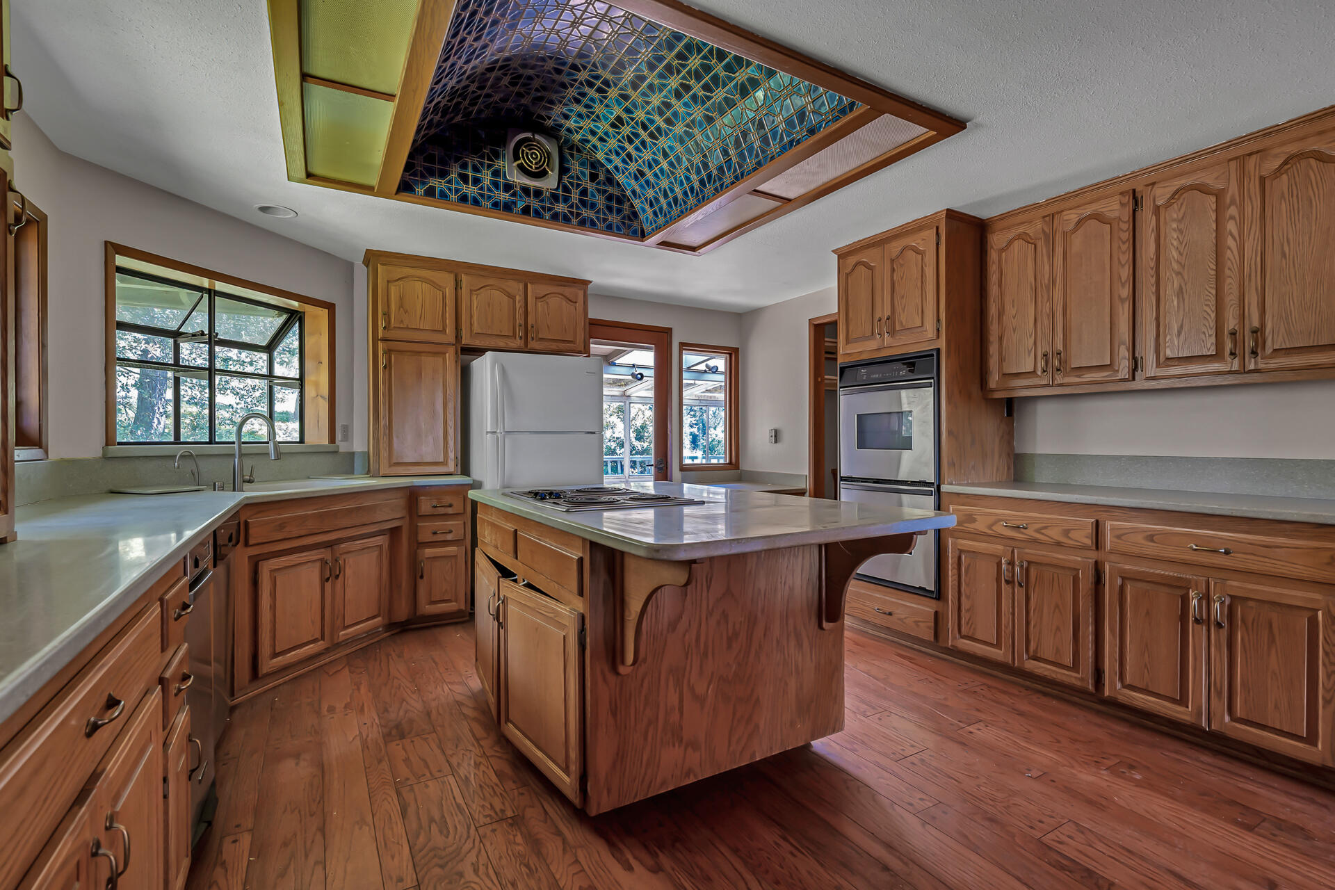 15368 Star Flower Road Oak Run, CA 96069 - Photo 33 of 63 a kitchen with stainless steel appliances granite countertop wooden floors and sink