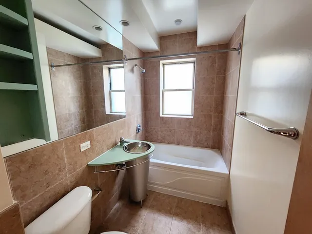 a bathroom with a sink toilet and bathtub
