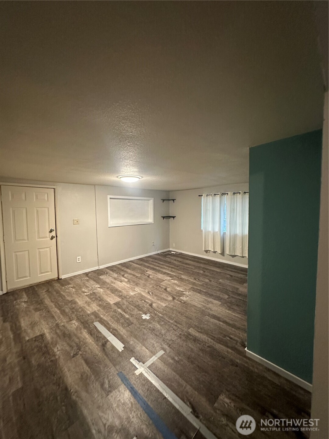 101 Walter Road Winlock, WA 98596 - Photo 14 of 25 a view of empty room with windows